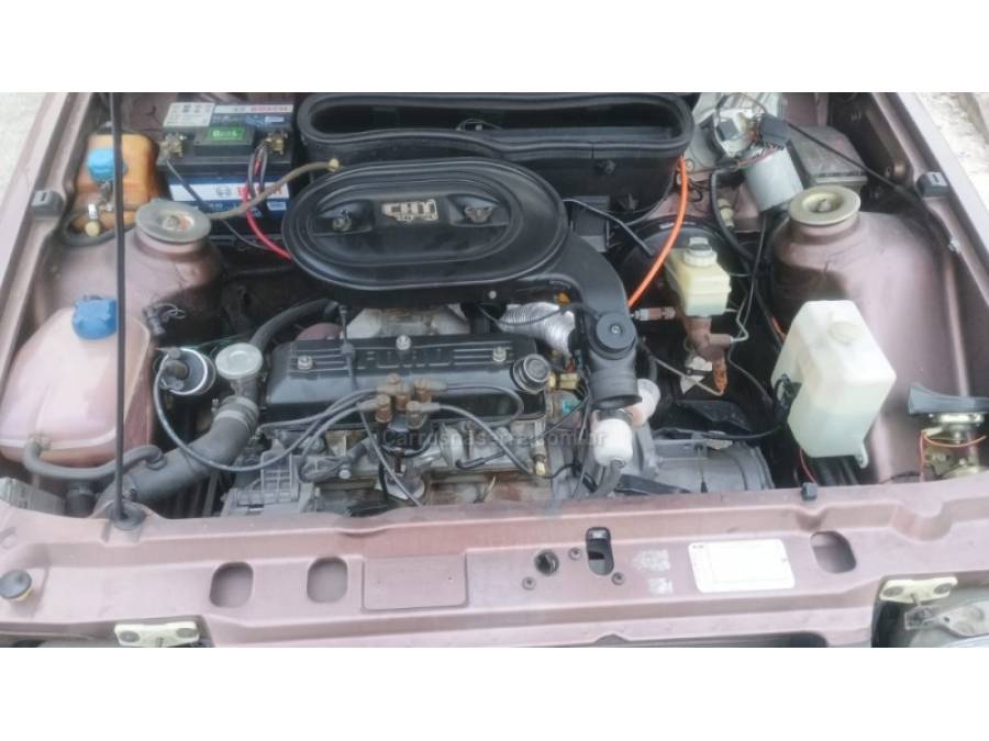 FORD - ESCORT - 1986/1987 - Marrom - R$ 19.900,00